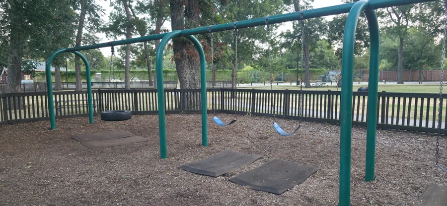 Swing set on the playground at Leonard Park.