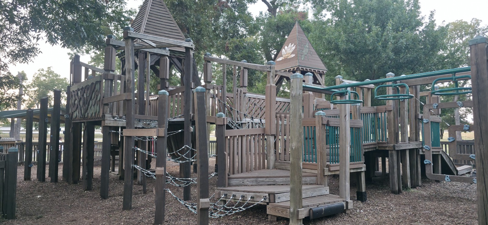 Wide view of the playground structures at Leonard Park.