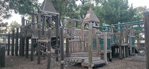 Wide view of the playground structures at Leonard Park.