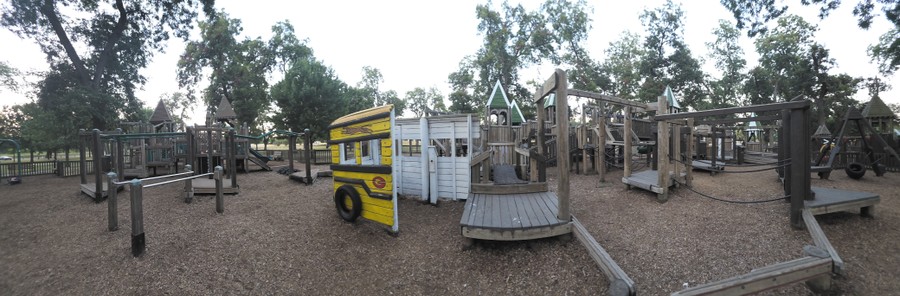 Panorama of the playground at Leonard Park at dusk.