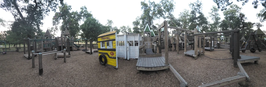 Panorama of the playground at Leonard Park at dusk.