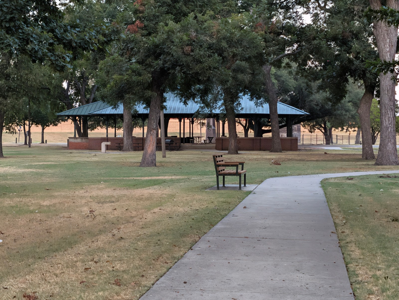 A bench along the path near the pavilion at Leonard Park.