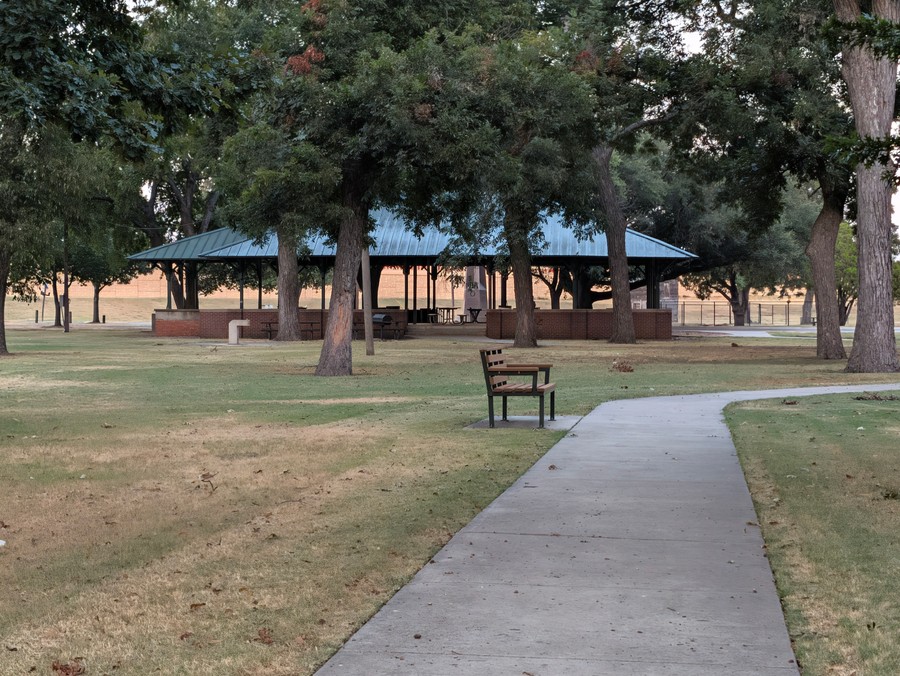 A bench along the path near the pavilion at Leonard Park.