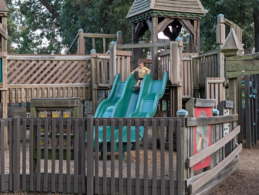 The fenced toddler slides and gazebo at Leonard Park.
