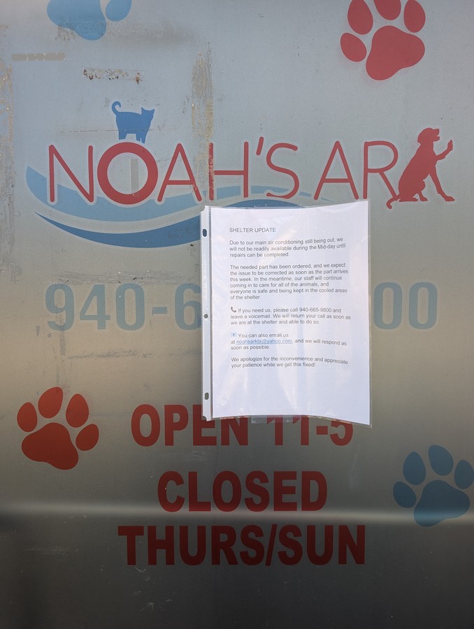 Hours on the door at Noah's Ark SPCA: open 11 to 5, closed Thursday and Sunday.