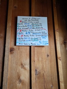 The hand-written buffet price board at Catfish Louie's and Neu Ranch House.
