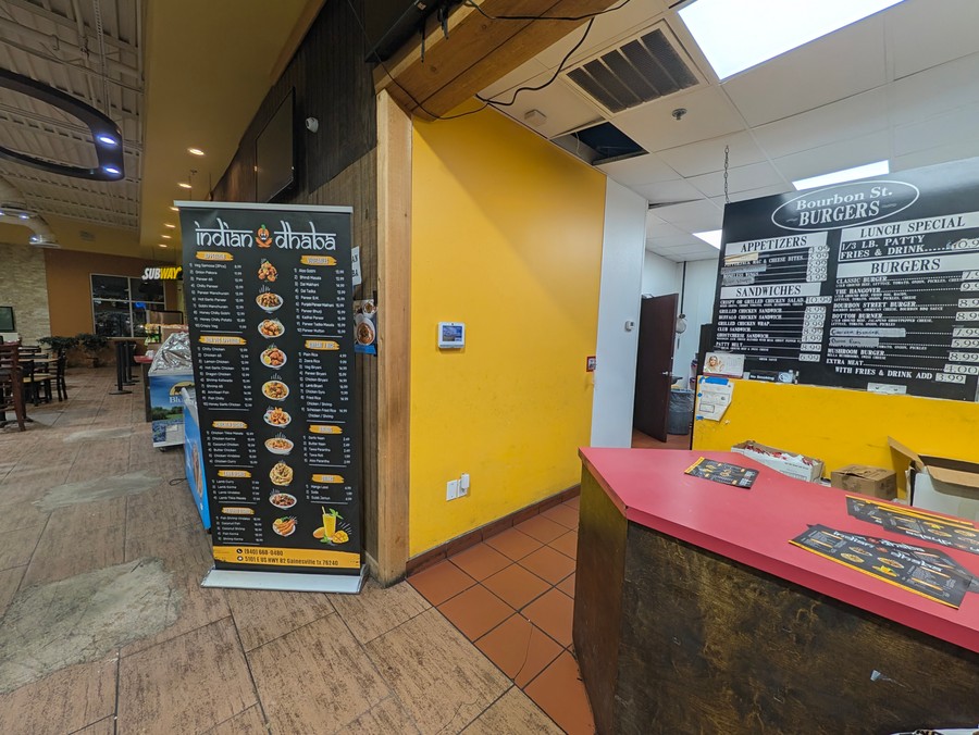 The order counter and menu boards at Indian Dhaba inside the 82 Travel Center.