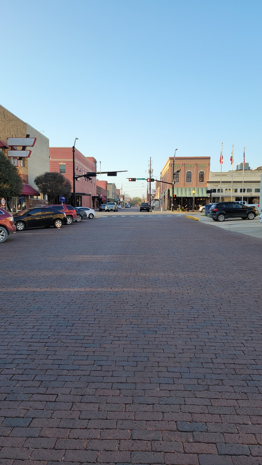Looking down the brick-paved street toward downtown Gainesville on an April evening in 2021.