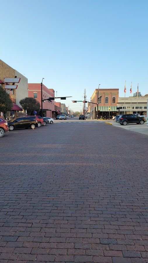 Looking down the brick-paved street toward downtown Gainesville on an April evening in 2021.