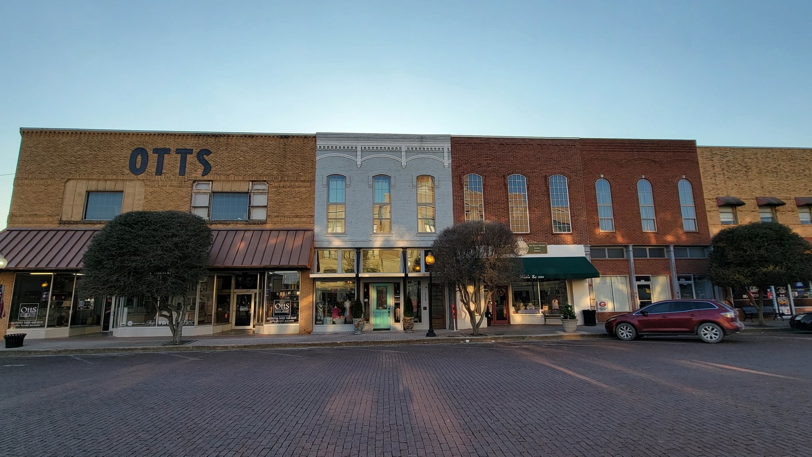 Otts Furniture & Appliance and its neighbors on the brick streets of downtown Gainesville, 2021.