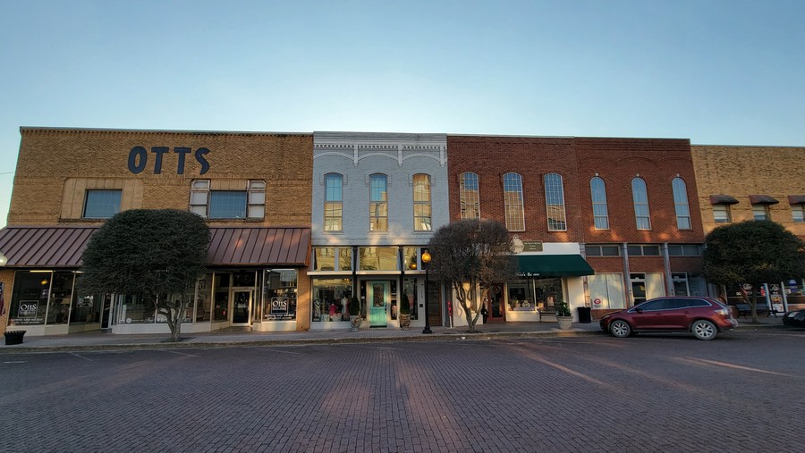 Otts Furniture & Appliance and its neighbors on the brick streets of downtown Gainesville, 2021.