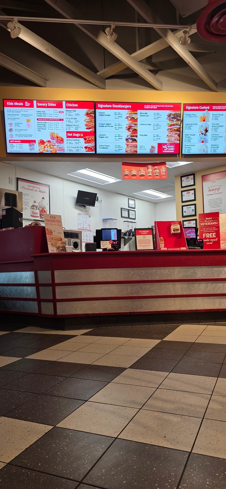 The order counter and menu boards at Freddy's Frozen Custard & Steakburgers, December 2025.