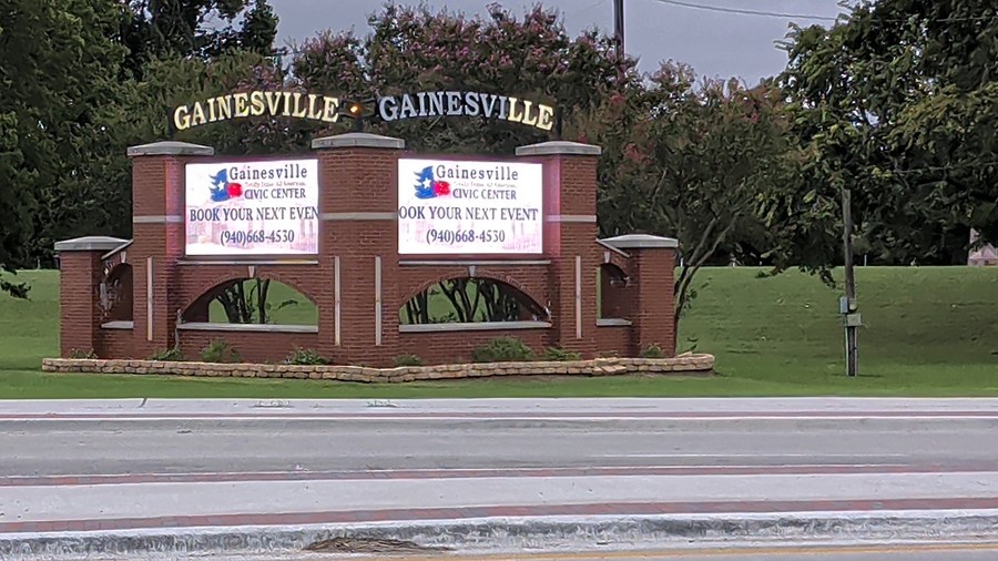 Both screens of the twin Gainesville marquee invite visitors to book an event at the Gainesville Civic Center.