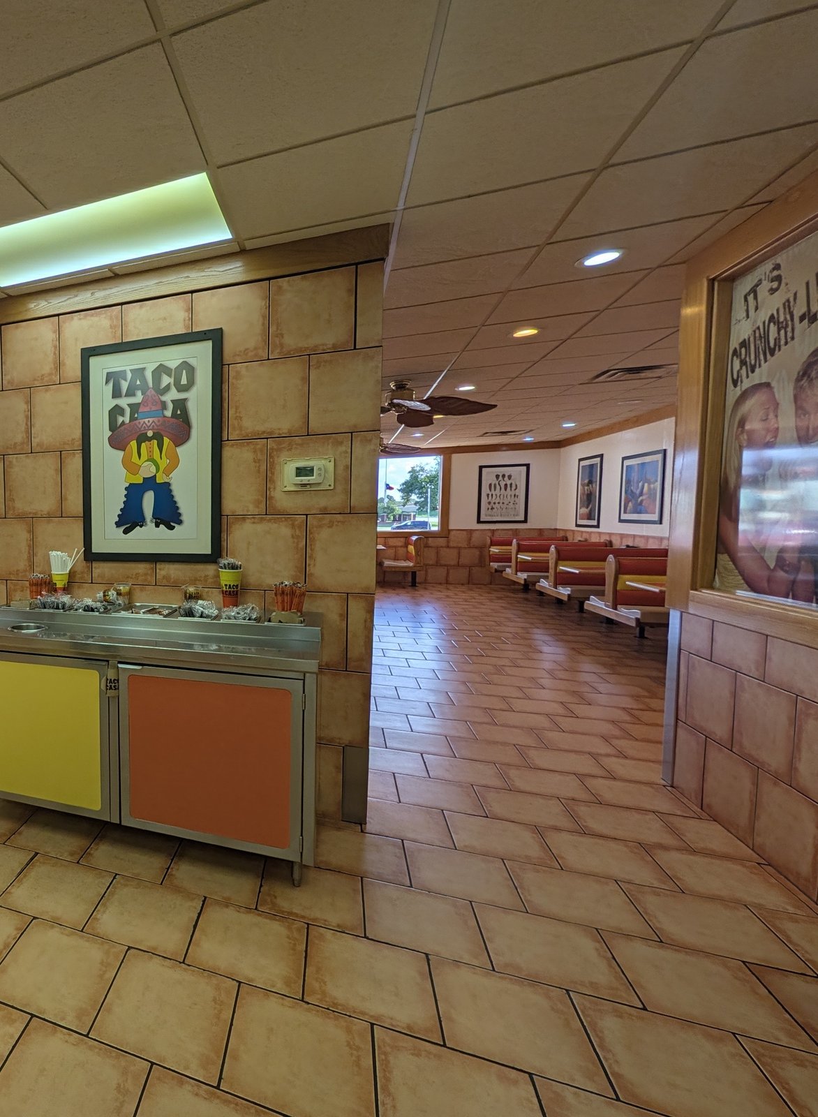 Taco Casa art hangs over the salsa bar, and red booths line the windows of the dining room.