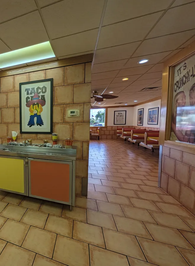Taco Casa art hangs over the salsa bar, and red booths line the windows of the dining room.