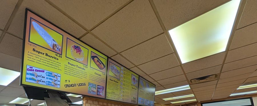 Taco Casa's menu boards show the Super Burrito, Super Tostada, Chilada and Super Nachos.